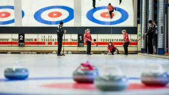 The curling stone is pushed